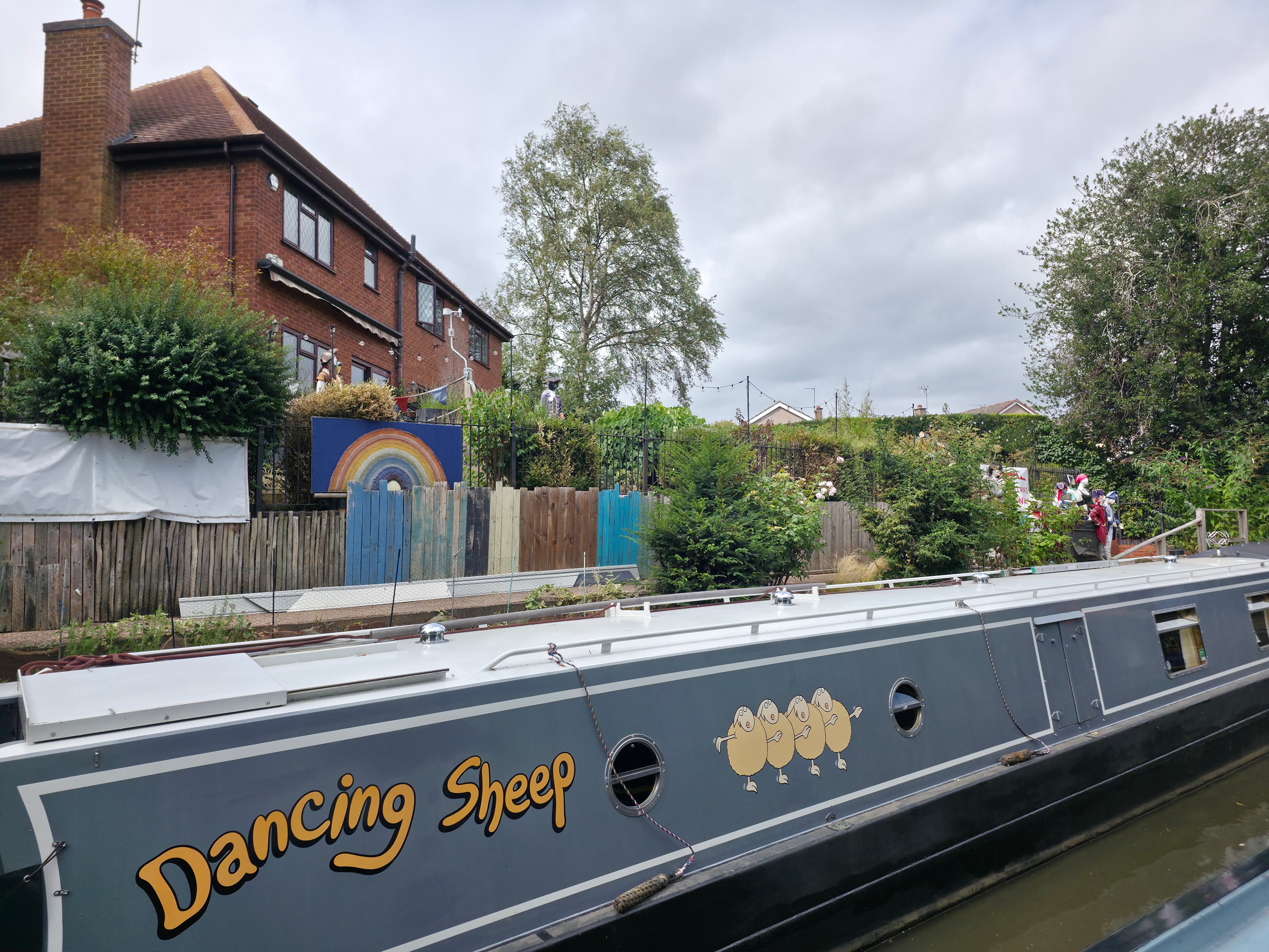 A narrowboat moored in a picturesque English canal village