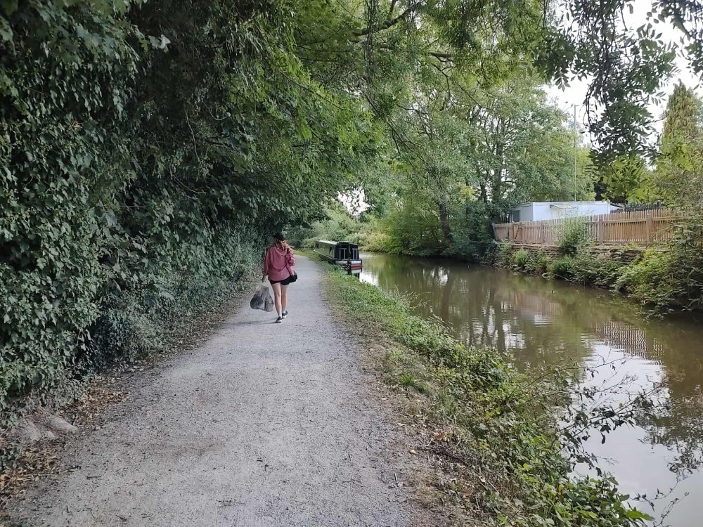 Walking the towpath at dusk with a narrowboat moored alongside