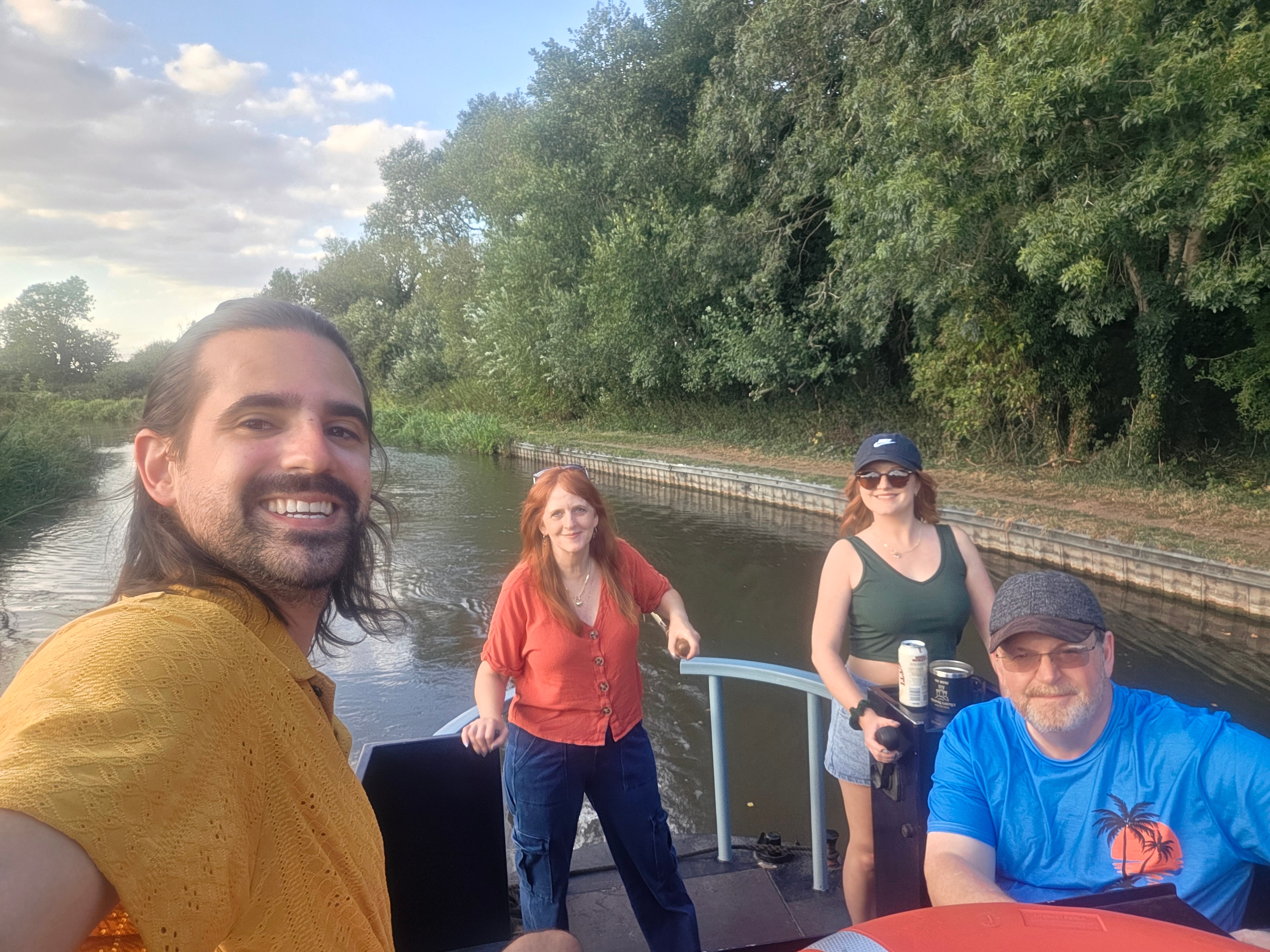 The crew aboard Curzon on the canal, August 2025